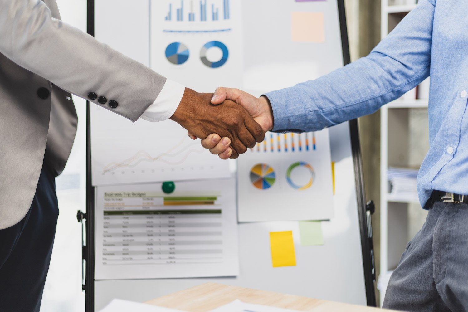 Meeting of business partners shaking hands in the office.